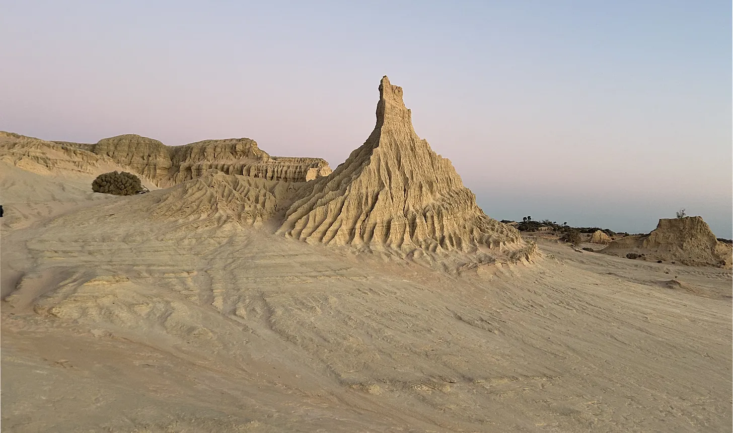 Dry lake bed at Mungo National Park, with cracked earth patterns under a wide sky.
